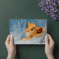 Lion Cub in Snowy Grass Mural Wallpaper — Cinematic Animation Style Mural Wallpaper - room preview 03