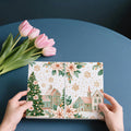 Pastel Winter Village Mural Wallpaper with Poinsettia Accents Mural Wallpaper - room preview 03
