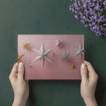 Hanging Paper Star Mural Wallpaper — Whimsical Soft Pink Decor Mural Wallpaper - room preview 03